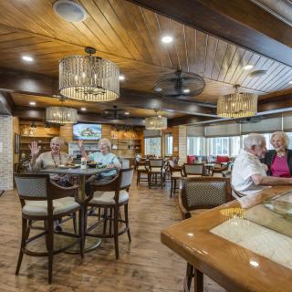 A cozy dining area with people enjoying their meals at a restaurant.
