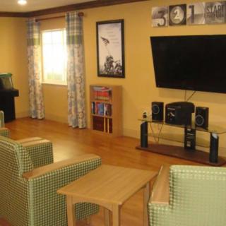 Cozy living room with a television and seating area.