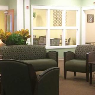 A cozy waiting area with comfortable chairs and a soothing color palette.