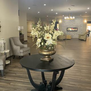A beautifully designed lobby featuring elegant furnishings and floral arrangements.