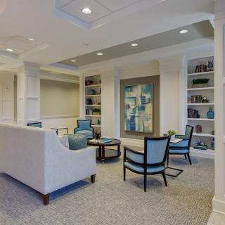 A modern living room with comfortable seating and decorative artwork.