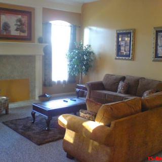 A cozy living room featuring comfortable seating and warm colors.