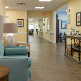 A welcoming hallway with cozy seating and decor.