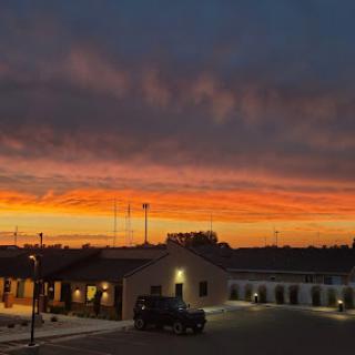 A stunning sunset casting vibrant colors over the buildings.