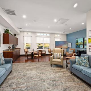 A cozy and modern lounge space featuring comfortable seating and natural light.