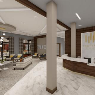 A modern and spacious lobby with seating and a reception area.