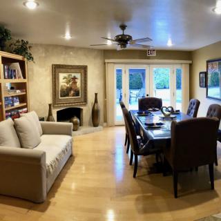 A cozy living and dining area with comfortable furniture and elegant decor.