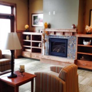 Cozy living room with a fireplace and comfortable seating.