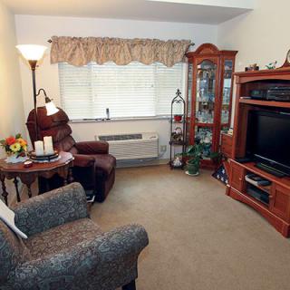 A cozy living room with comfortable seating and a television.