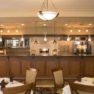A cozy restaurant interior with elegant lighting and comfortable seating.