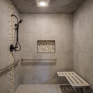 Modern accessible bathroom with a shower bench and grab bar.