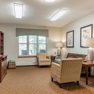 A cozy living room with comfortable seating, ambient lighting, and tasteful decor.