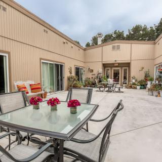 A tranquil outdoor patio setting, perfect for enjoying time with friends and family.