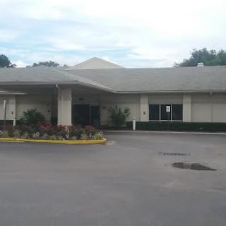A modern facility with a landscaped entrance.