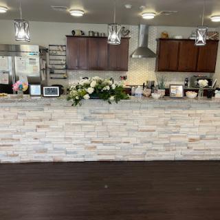 A modern kitchen featuring a stylish countertop, elegant decor, and well-organized appliances.