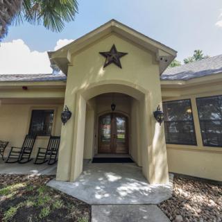 A welcoming entrance to a residential home with a star decoration above the door.