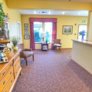 A cozy reception area with comfortable chairs and stylish decor.