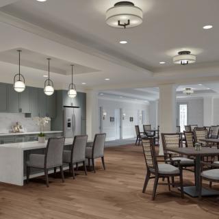 A spacious, modern dining and kitchen area with elegant furnishings and lighting.