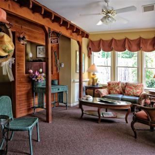 A cozy living room with vintage decor and wooden accents.