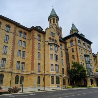 A historic building with prominent towers and detailed architectural features.