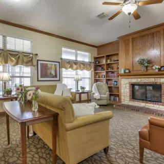 A cozy living room featuring a fireplace and comfortable seating.