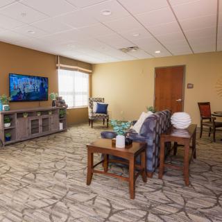 A cozy living room with comfortable seating and a television.