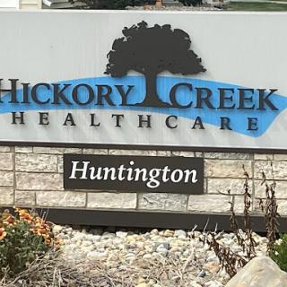 Sign for Hickory Creek Healthcare located in Huntington.