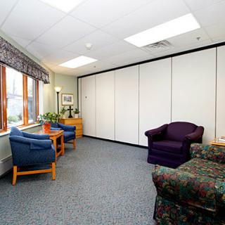A cozy and inviting waiting room with comfortable seating and natural light.