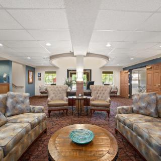 A modern living room with comfortable seating and elegant decor.