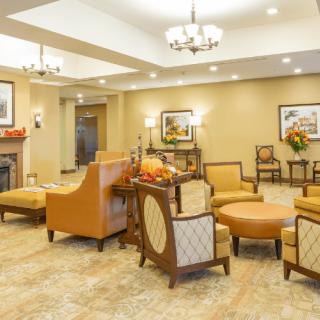 A comfortable and inviting lobby area with elegant seating arrangements and warm lighting.