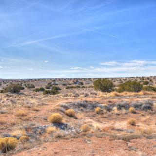 A serene desert landscape under a clear blue sky.
