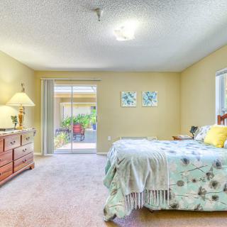 A cozy and bright bedroom with elegant decor and a comfortable bed.