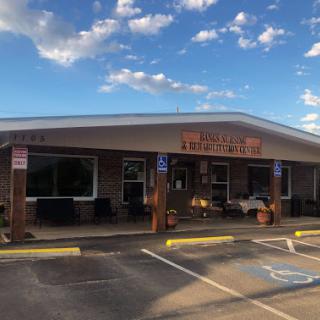 A charming restaurant with a welcoming exterior on a beautiful day.