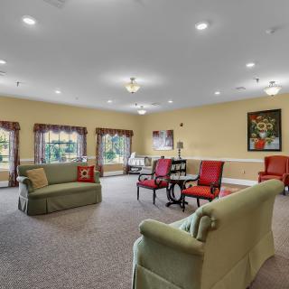 A spacious living room with comfortable seating and elegant decor.