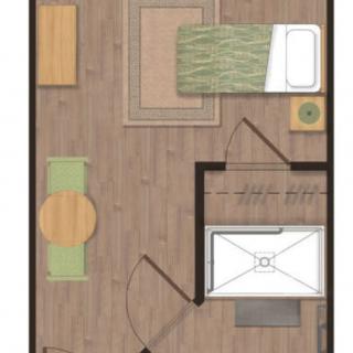 A simple floor plan showcasing a small room with a single bed, desk, and dining area.