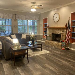 Cozy living room with a fireplace and modern decor.