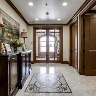 A well-decorated entryway featuring elegant woodwork and classic decor.