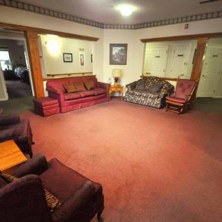 A cozy living room with traditional furniture and a warm atmosphere.