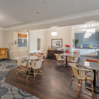 A cozy lobby area with comfortable seating and warm lighting.