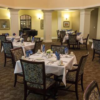 Elegant restaurant dining area with tables set for guests.