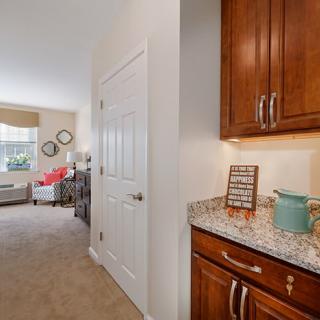 A cozy home interior with a view of the kitchen and living room area.