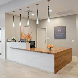 A modern office reception area with stylish lighting and decor.