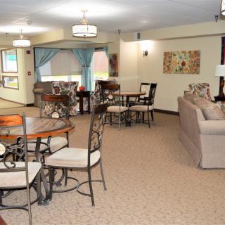 A spacious living room with modern decor and a dining area.