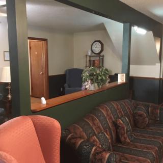 A cozy lobby area with comfortable seating and decorative elements.