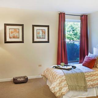 A cozy bedroom interior with elegant decor and warm lighting.