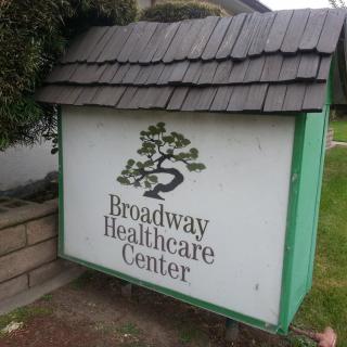 Sign for Broadway Healthcare Center in an outdoor setting.