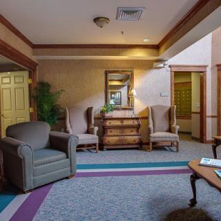 A cozy lobby area with comfortable seating and elegant decor.