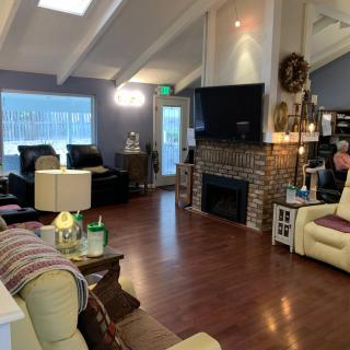 Cozy living room with a brick fireplace and modern decor.
