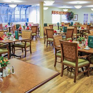 Spacious dining area with neatly arranged tables and chairs.