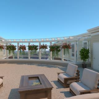 A sunny patio with seating and a fire pit surrounded by plants.